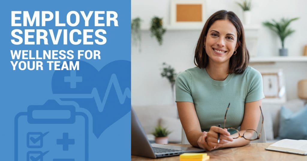 Woman seated at a desk, holding glasses, with a laptop and notebook in front. Text reads Health Employer Services: Wellness for Your Team on a blue background adorned with Catalina Island-inspired health-themed icons.